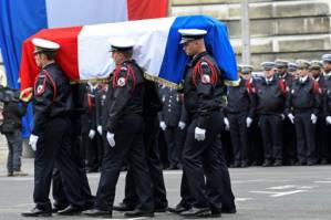 Macron, Le Pen attend ceremony for slain policeman.jpg