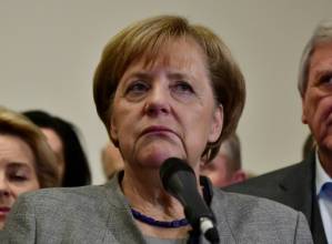 Merkel battles to stay in power despite crisis.jpg