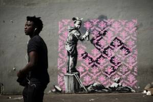 Banksy needles France on migrants with Paris mural blitz.jpg