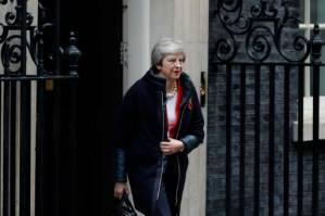 UK's May takes Brexit deal to cabinet as MPs revolt.jpg