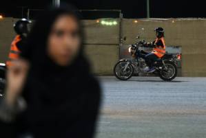 Saudi women rev up motorbikes as end to driving ban nears.jpg