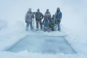 Antarctic researchers mark winter solstice with icy plunge.jpg