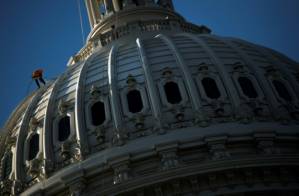 US economy booms as elections near, but who gets credit.jpg