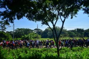 Honduran migrants march as Trump vows 'full efforts' to halt them.jpg