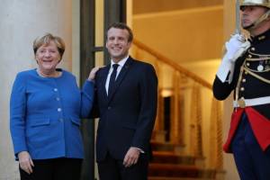 Macron, Merkel meet to harmonise positions before EU summit.jpg