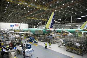 Boeing says to halt 737 MAX production next month.jpg