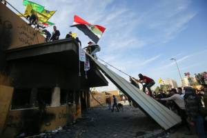 Pro-Iran protesters leave US embassy in Baghdad.jpg