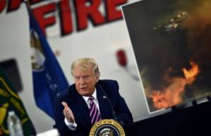 Trump dismisses climate concerns as he visits fire-ravaged western US.jpg