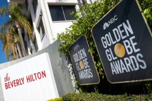 Golden Globes eye history as show goes on without stars.jpg