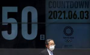 Olympics chief says cancellation unlikely as 10,000 volunteers quit.jpg