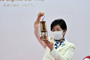Olympic flame arrives in Tokyo for no-spectator relay.jpg