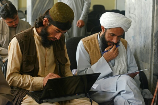 Taliban fighters swap arms for books as hundreds return to school