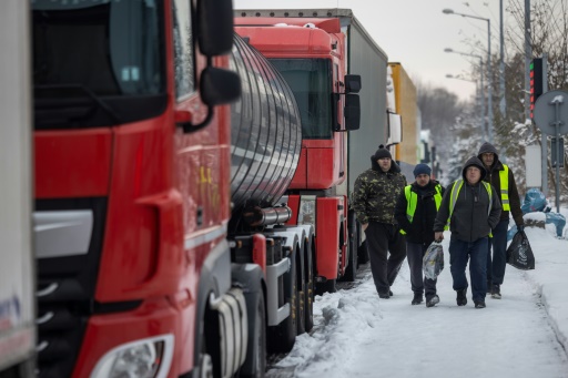 Ukrainian truckers stranded in Poland battle cold