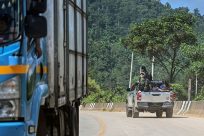 Myanmar truckers slog on as conflict clogs trade highway.jpg