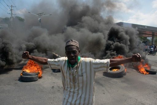 Gunfire booms in Haiti as politicians seek to form interim gov't.