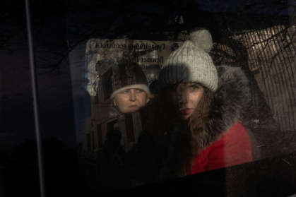 Anna (R), 21, and her mother (L) sit in a minivan as they wait at an evacuation point outside the city, in the eastern Donetsk region, on December 14, 2024, as Russian troops advanced close to the city. Anna (R), 21, and her mother (L) sit in a minivan as they wait at an evacuation point outside the city, in the eastern Donetsk region, on December 14, 2024, as Russian troops advanced close to the city.