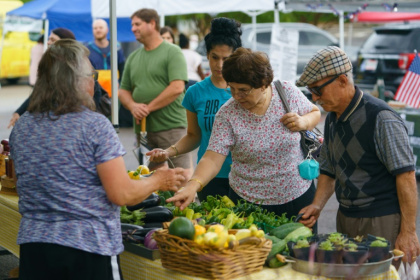 People shop for fresh produce and food at a farmer's market on June 29, 2021, in Homewood, Alabama People shop for fresh produce and food at a farmer's market on June 29, 2021, in Homewood, Alabama