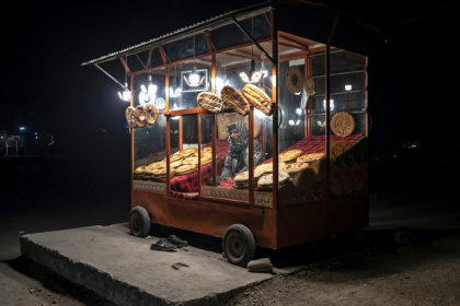 An Afghan vendor selling bread waits for customers by the roadside in Kabul An Afghan vendor selling bread waits for customers by the roadside in Kabul