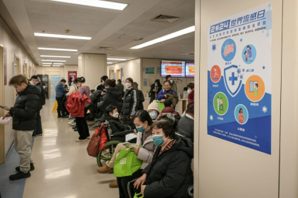 People wearing masks wait in the respiratory department of a Beijing hospital this week People wearing masks wait in the respiratory department of a Beijing hospital this week