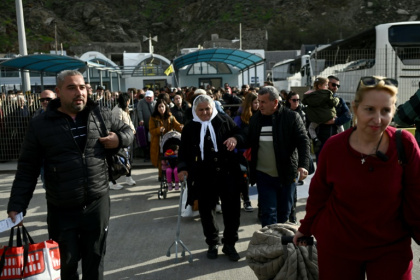 Crowds embarking a ferry to leave Santorini on Monday Crowds embarking a ferry to leave Santorini on Monday