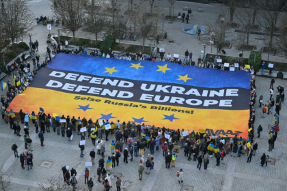 Demonstrators display a giant banner in the colours of the Ukrainian flag in Brussels on the eve of a special EU summit Demonstrators display a giant banner in the colours of the Ukrainian flag in Brussels on the eve of a special EU summit