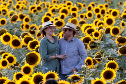 A couple smile during the sunset in Tlajomulco de Zuniga, Mexico A couple smile during the sunset in Tlajomulco de Zuniga, Mexico