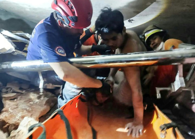 A joint team of Myanmar and Turkish rescuers pull a man alive from the rubble of a hotel in the capital Naypyidaw, five days after a major earthquake A joint team of Myanmar and Turkish rescuers pull a man alive from the rubble of a hotel in the capital Naypyidaw, five days after a major earthquake