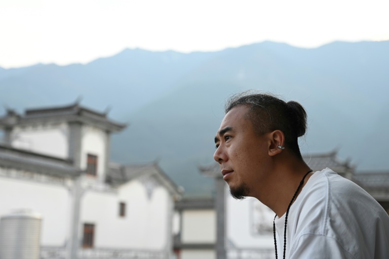 Jaded young Chinese reset lives with rural 'retirement'