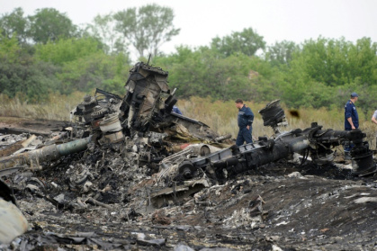 Rescuers stand on July 18, 2014 on the site of the crash of a Malaysian airliner carrying 298 people from Amsterdam to Kuala Lumpur, near the town of Shaktarsk, in rebel-held eastern Ukraine - DOMINIQUE FAGET (AFP) Rescuers stand on July 18, 2014 on the site of the crash of a Malaysian airliner carrying 298 people from Amsterdam to Kuala Lumpur, near the town of Shaktarsk, in rebel-held eastern Ukraine - DOMINIQUE FAGET (AFP)