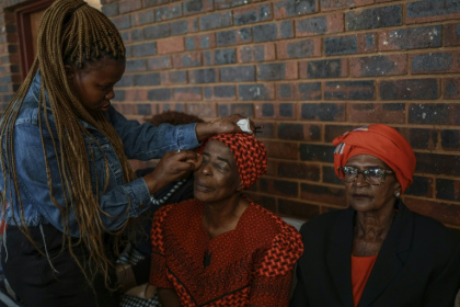 At the makeup corner, the top request was deep red and berry toned lipsticks - Phill Magakoe (AFP) At the makeup corner, the top request was deep red and berry toned lipsticks - Phill Magakoe (AFP)