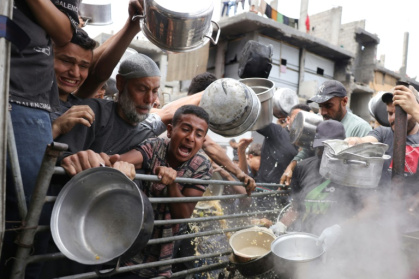 Palestinians struggle to get their food rations at a distribution centre in the northern Gaza Strip - BASHAR TALEB (AFP) Palestinians struggle to get their food rations at a distribution centre in the northern Gaza Strip - BASHAR TALEB (AFP)