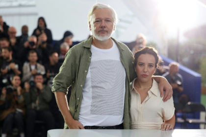 Assange wearing a t-shirt with the names of killed Gaza children, with his wife Stella - Sameer Al-Doumy (AFP) Assange wearing a t-shirt with the names of killed Gaza children, with his wife Stella - Sameer Al-Doumy (AFP)