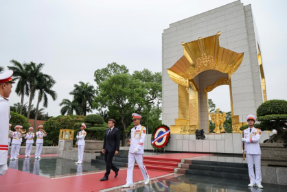 After paying tribute at a Hanoi war memorial to those who fought against French colonial occupation, the French president has a day of talks ahead - Ludovic MARIN (AFP) After paying tribute at a Hanoi war memorial to those who fought against French colonial occupation, the French president has a day of talks ahead - Ludovic MARIN (AFP)