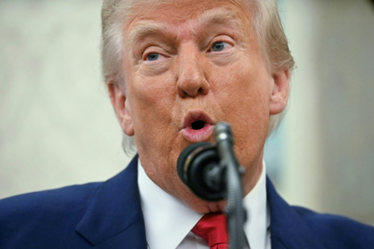 US President Donald Trump says using negotiating tactics to advance the interests of the United States is not the same as "chickening out" - Jim WATSON (AFP) US President Donald Trump says using negotiating tactics to advance the interests of the United States is not the same as "chickening out" - Jim WATSON (AFP)