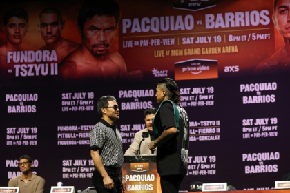 Filipino boxing legend Manny Pacquiao (left) faces off against WBC welterweight champion Mario Barrios ahead of his comeback next month - Patrick T. Fallon (AFP)