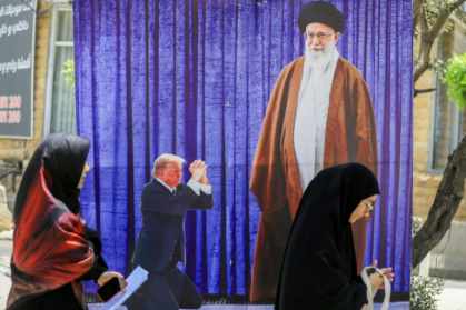 A poster depicting US President Donald Trump prostrating in front of Iran's Ayatollah Ali Kamenei hangs in a southern Beirut suburb - - (AFP) A poster depicting US President Donald Trump prostrating in front of Iran's Ayatollah Ali Kamenei hangs in a southern Beirut suburb - - (AFP)