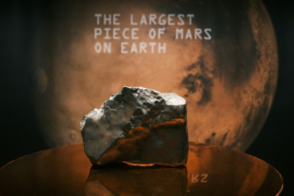 The 54-pound Martian meteorite NWA 16788, the largest known piece of Mars ever discovered on Earth, was sold for a record $5.3 million at Sotheby's New York - CHARLY TRIBALLEAU (AFP)