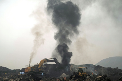A plume of smoke rises as a worker operates a bulldozer to convey heaps of raw coal on the outskirts of Dhanbad, in India's Jharkhand state - Vishal kumar singh (AFP) A plume of smoke rises as a worker operates a bulldozer to convey heaps of raw coal on the outskirts of Dhanbad, in India's Jharkhand state - Vishal kumar singh (AFP)