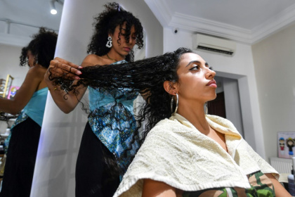 Many Tunisian women are embracing natural hairstyles, bucking a longstanding social stigma around curls - FETHI BELAID (AFP) Many Tunisian women are embracing natural hairstyles, bucking a longstanding social stigma around curls - FETHI BELAID (AFP)