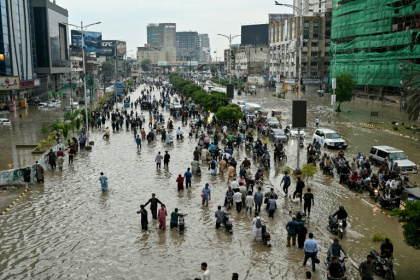 People wade through a flooded street after heavy rainfall in Karachi - Asif HASSAN (AFP) People wade through a flooded street after heavy rainfall in Karachi - Asif HASSAN (AFP)