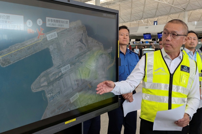 Cargo plane skids off Hong Kong runway, kills two