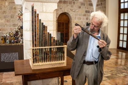 A man inspects a piece of the functioning replica from the oldest organ in Christendom, during the instrument's unveiling at the Saint Saviour's Monastery in the old city of Jerusalem - JOHN WESSELS (AFP) A man inspects a piece of the functioning replica from the oldest organ in Christendom, during the instrument's unveiling at the Saint Saviour's Monastery in the old city of Jerusalem - JOHN WESSELS (AFP)