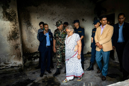 Nepal's interim leader Sushila Karki (C, inspecting a torched police station) vowed to follow protesters' demands to 'end corruption' in the Himalayan nation - PRABIN RANABHAT (AFP) Nepal's interim leader Sushila Karki (C, inspecting a torched police station) vowed to follow protesters' demands to 'end corruption' in the Himalayan nation - PRABIN RANABHAT (AFP)