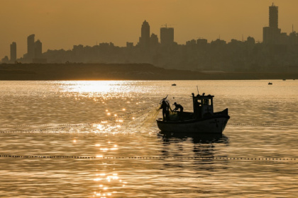 A fisherman pulls his net from the Mediterranean Sea on a trawler off Dbayeh near Lebanon's capital Beirut - JOSEPH EID (AFP) A fisherman pulls his net from the Mediterranean Sea on a trawler off Dbayeh near Lebanon's capital Beirut - JOSEPH EID (AFP)