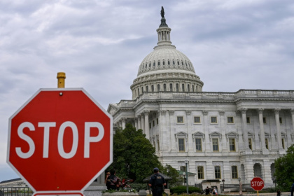 A stop sign is seen in front of the US Capitol -- where talks to reopen the federal government have seen little progress - Alex WROBLEWSKI (AFP) A stop sign is seen in front of the US Capitol -- where talks to reopen the federal government have seen little progress - Alex WROBLEWSKI (AFP)