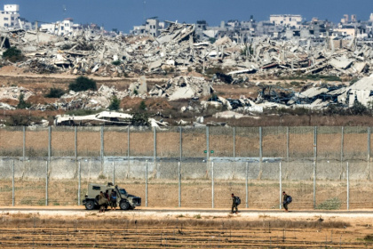 Israeli army soldiers walk towards an armoured vehicle at a position along the border fence with the Gaza Strip in southern Israel - Jack GUEZ (AFP) Israeli army soldiers walk towards an armoured vehicle at a position along the border fence with the Gaza Strip in southern Israel - Jack GUEZ (AFP)