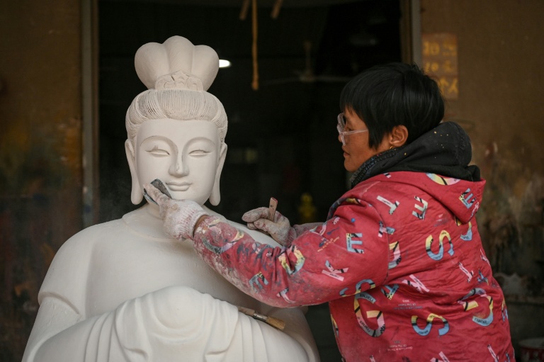 China's Buddha artisans carve out a living from dying trade