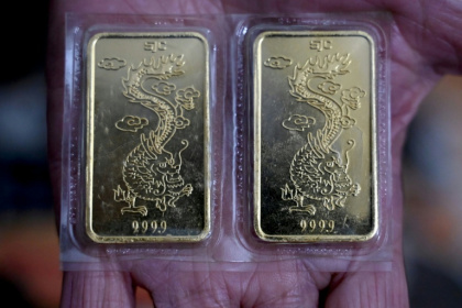 The extraordinary run-up in gold prices has brought unexpected windfalls to millions of Vietnamese holding hallmarked bars and rings seen as symbols of luck, but has also touched off a wave of speculation - Nhac NGUYEN (AFP)