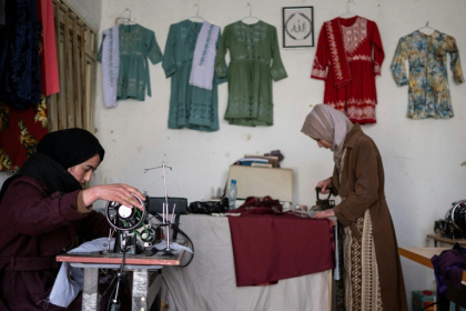 Afghan Rahima Alavi (L), who runs an embroidery boutique in Bamiyan, feels proud she can support her family - Wakil KOHSAR (AFP)