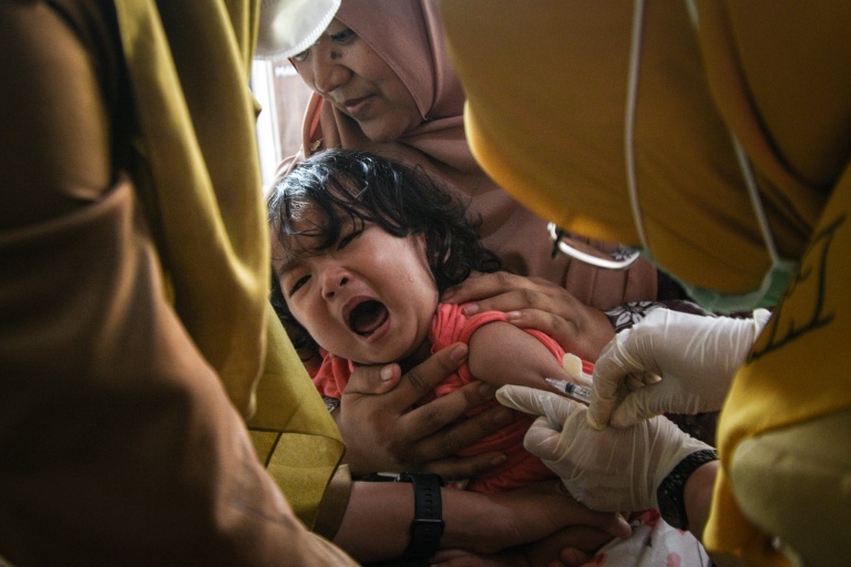 Vitamins over vaccines: misinformation entrenched amid Indonesia measles surge